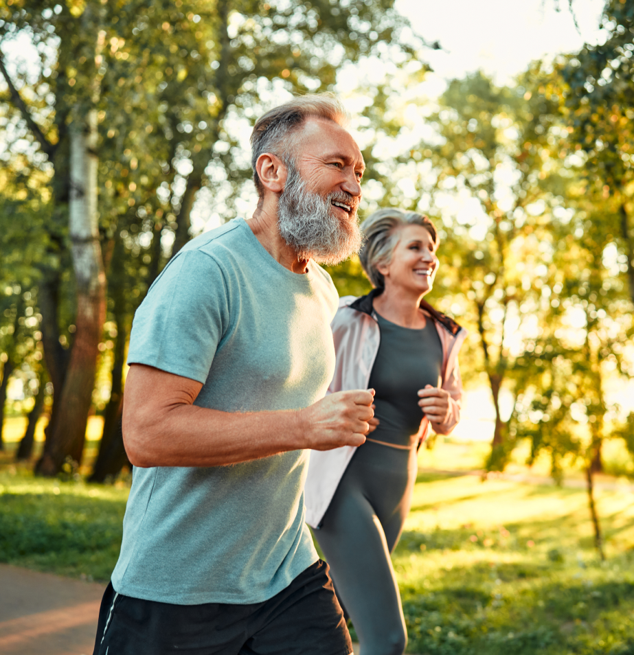 A man and woman running in the park